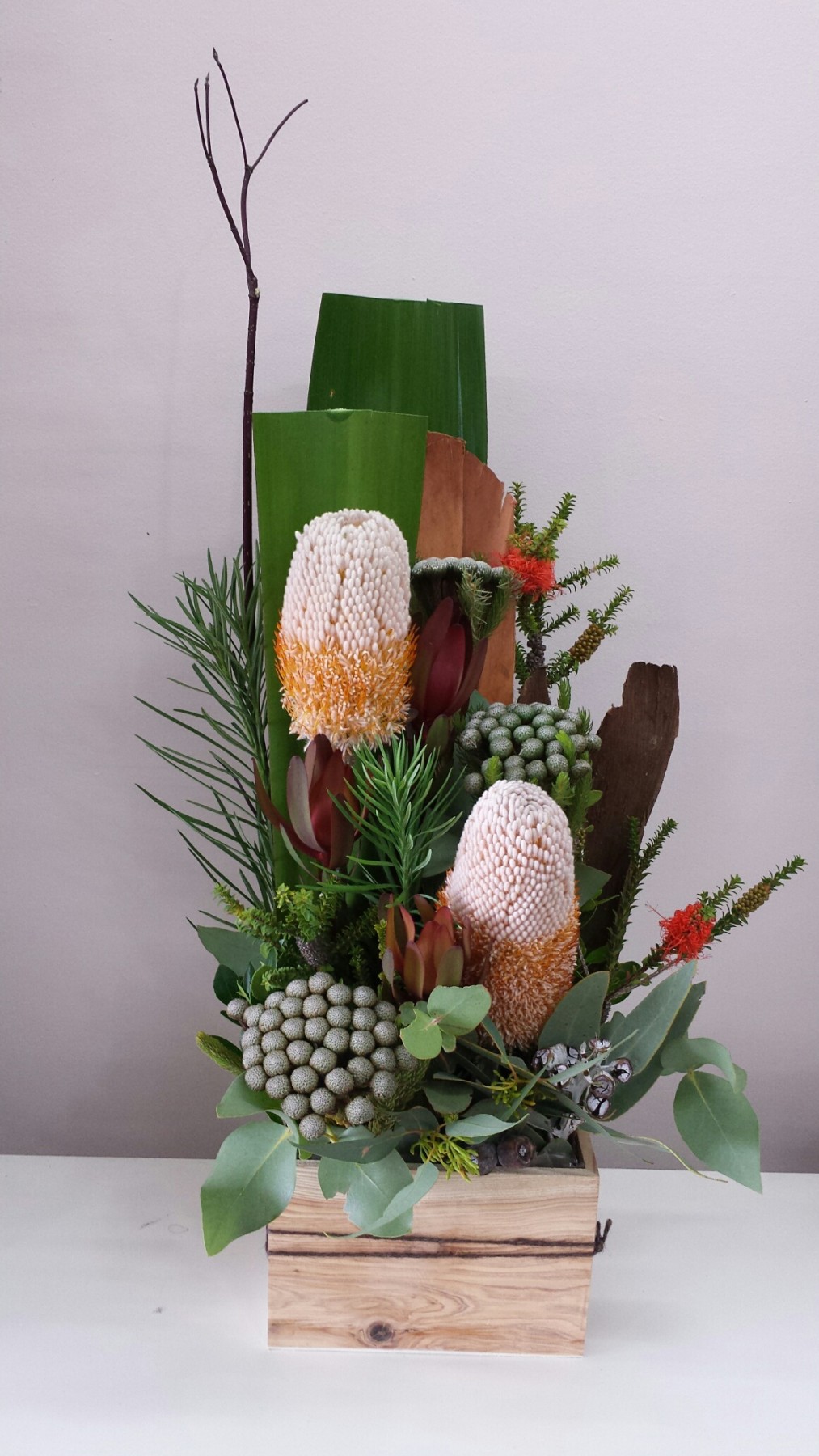 Mix of seasonal native flowers arranged in a wood box
