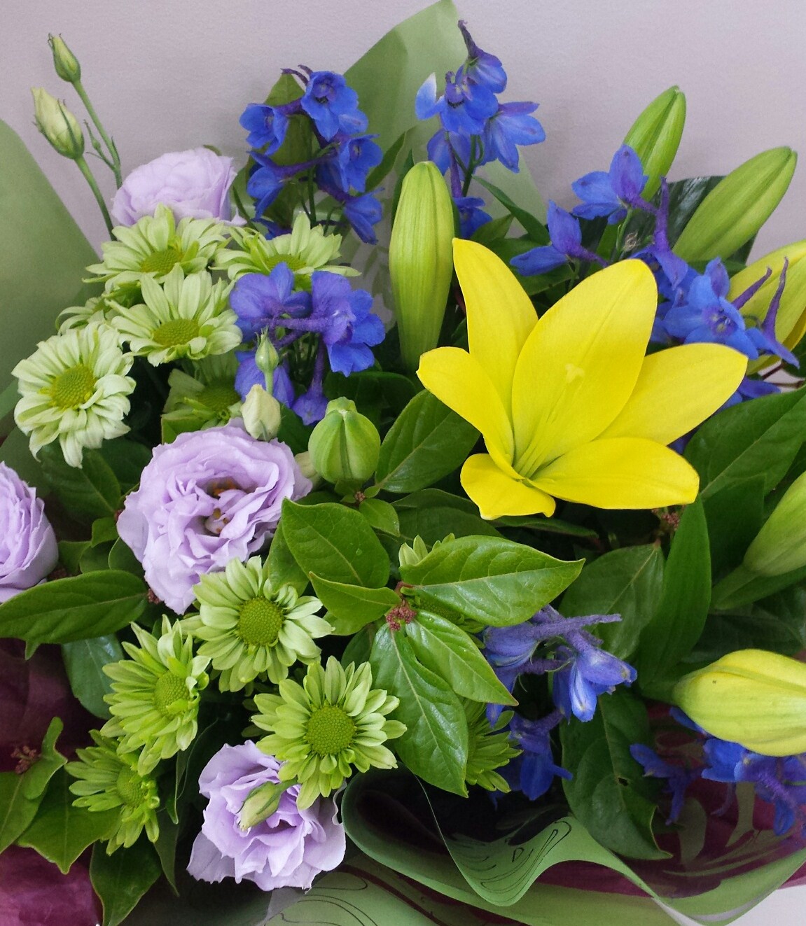 Bright selection of seasonal flowers wrapped to present