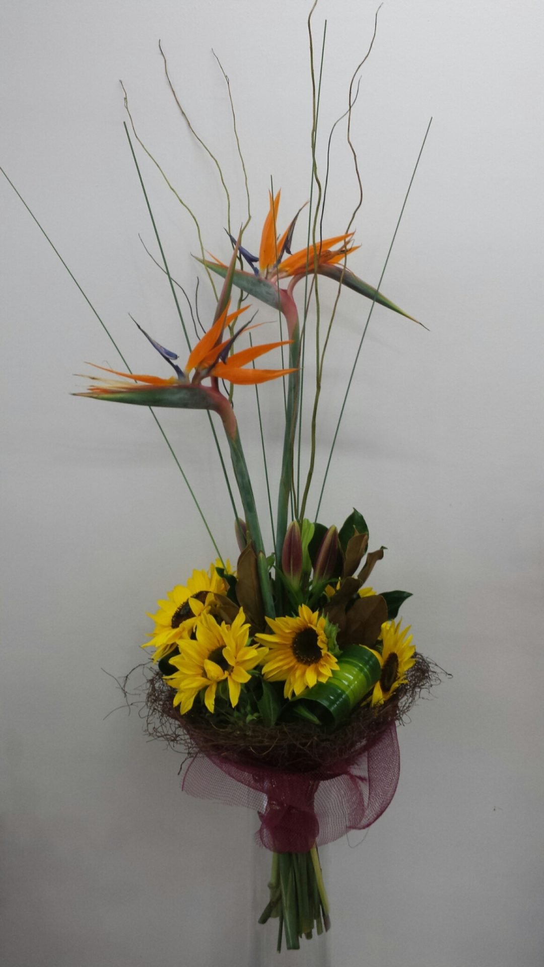 Presentation bouquet of Bird of paradise and sunflower