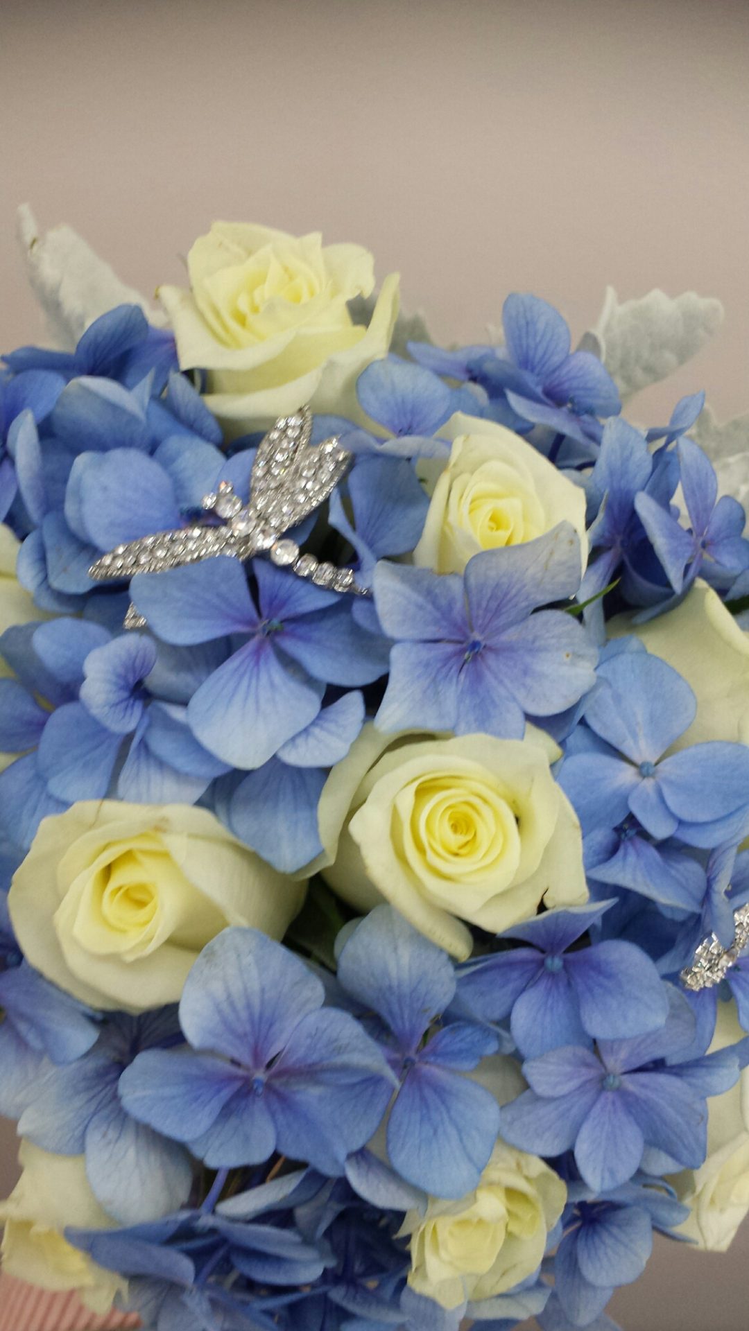 Blue hydrangea and white roses