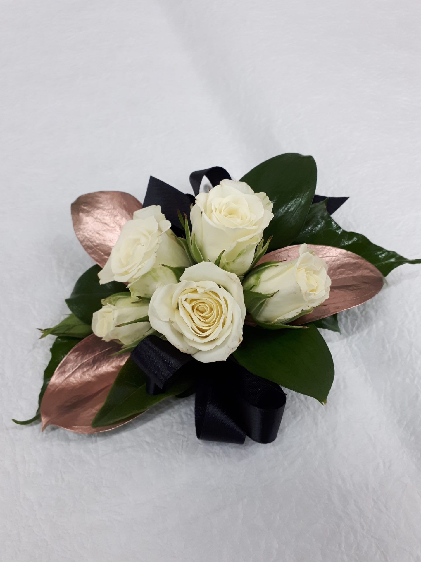 White spray roses with rose gold leaves