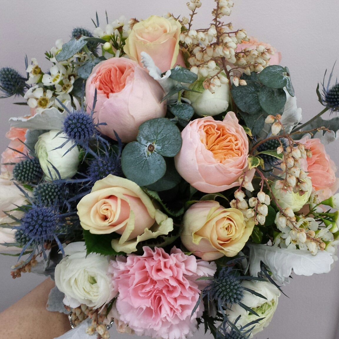 sea holly, garden roses, andromeda and carnation