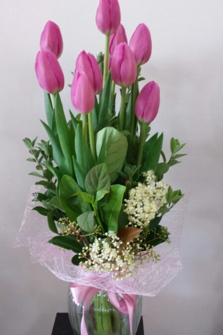 Tulips arranged in a glass vase.
