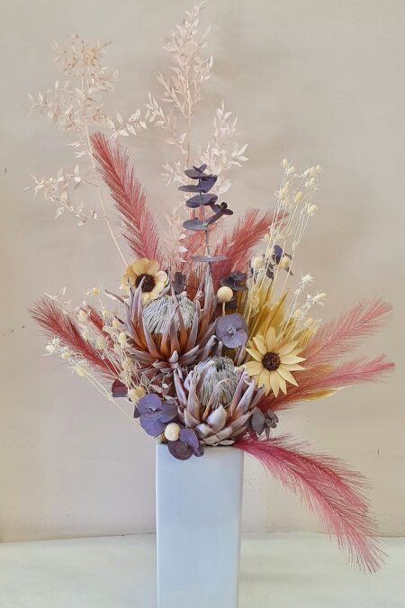 Preserved dusty pin and natural flowers